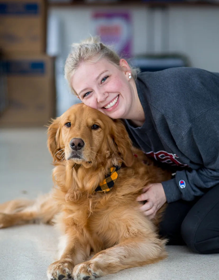 Sam with golden retriever at Tacoma Animal Hospital